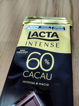 Packaging lacta dark chocolate bar 60%  on the wooden table. May, 10, 2024, Itabira, Minas Gerais, Brazil.
