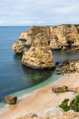 Obraz premium Marina Beach (Praia da Marinha) in Lagoa, Faro District, Algarve, Southern Portugal. Algarve beaches are a touristic paradise