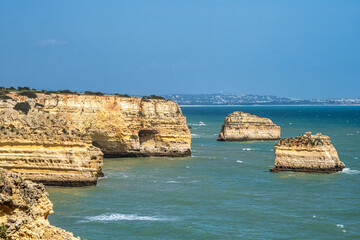 Praia da Marinha Beach among rock islets and cliffs seen from Seven Hanging Valleys Trail, Algarve,...