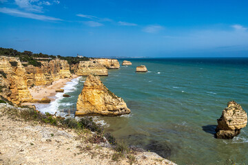 Praia da Marinha Beach among rock islets and cliffs seen from Seven Hanging Valleys Trail, Algarve,...