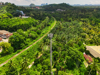 aerial view Railway tracks in the suburbs. The railway line crosses the river. The bridge connects...