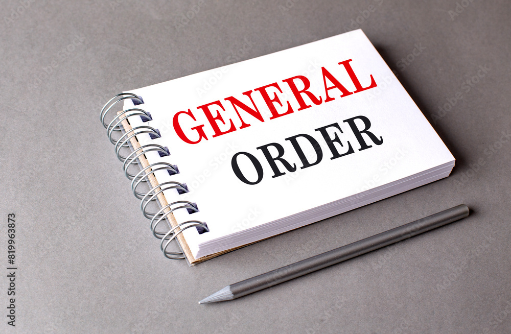 Poster general order text on notebook on grey background