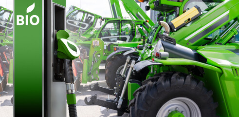 Biofuel filling station on a background of green construction machines. Decarbonization of heavy...