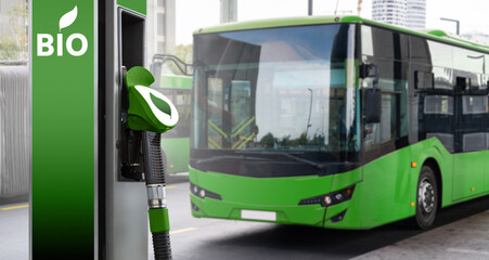 Biofuel filling station on a background of green city bus. Decarbonization of public transport