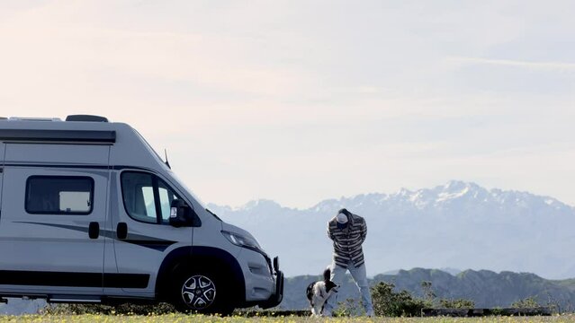 A man enjoys traveling with his dog. Family holidays, caravan holidays, caravan holidays, campervan holidays.