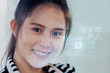 Asian female using mobile smartphone scanning  face ID to unlock phone security with facial...