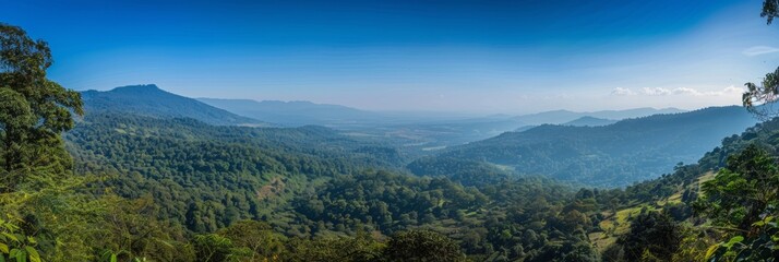 Expansive view of a lush green mountain range under a clear blue sky, vast natural scenery. - Powered by Adobe