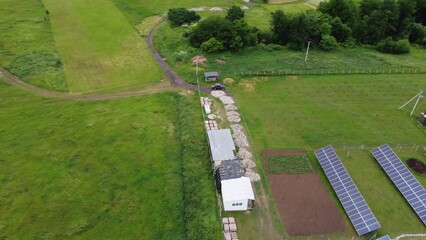 Aerial view of Solar Panels Farm solar cell with sunlight. Drone flight over solar panels field,...