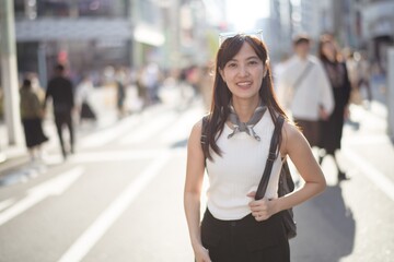 Tokyo vibes: A confident Japanese woman 30s, blending business, technology, and urban style in the...