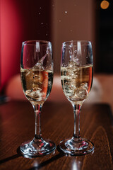 a splash of champagne from the glass where the wedding rings were thrown