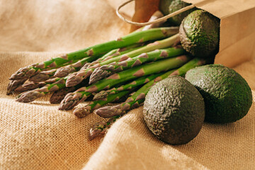 Green asparagus, and fresh avocados close-up