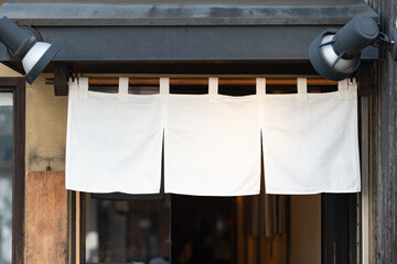 The curtain-like fabric that hangs in front of traditional Japanese restaurants and shops not only serves as a signboard, but holds a larger meaning,