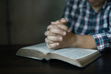 Christian congregation gathered at church, each hand holding Bible, Unwavering faith, prayer and...