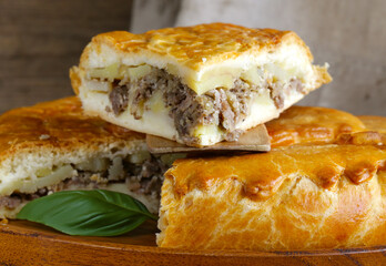 homemade meat pie with potatoes on the table