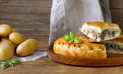 homemade meat pie with potatoes on the table