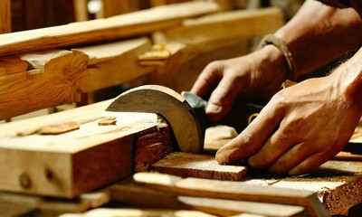 A carpenter is engaged in rough processing of wood