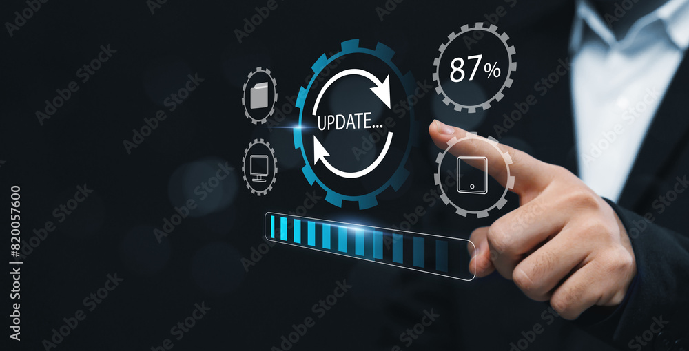 Fototapete Updating computer system software application installation for devices to be up to date with the new version. Hand interacting with graphics icon updating function screen loading on computer laptop.