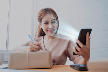 Female using mobile smartphone scanning  face ID to unlock phone security with facial recognition technology for identification, access to financial bank assets cash and money.