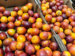 blood oranges lie on the counter in a grocery store, fruits for sale