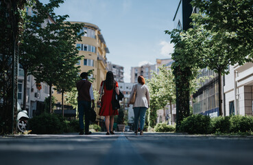 A group of business partners engage in a discussion about marketing strategies and revenue growth at an informal outdoor meeting.