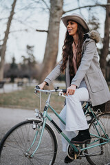 A poised business lady enjoys a peaceful moment with her classic bicycle in the serenity of an...