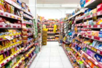 blur Row aisle list of famous well known brand cheap candies and snack rack at 24 hour open convenient store souvenir supermarket mini market chain in south east asia Surabaya, Indonesia