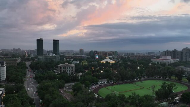 Aerial view of the central part of the Kazakh city of Almaty on a spring evening at sunset