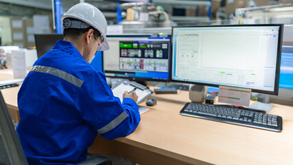 Engineer working at control room,Manager control system,Technician man monitoring program from a...