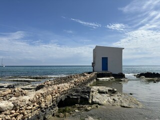 Calpe beach and a curious registration booth.