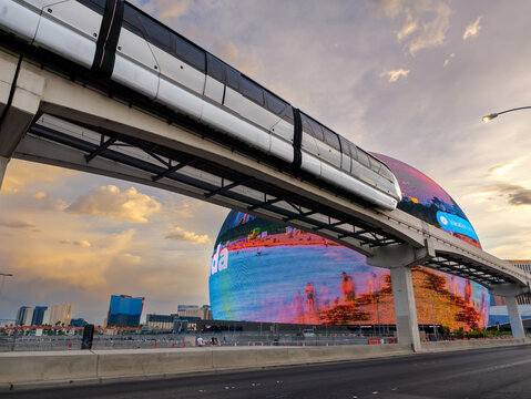 Las Vegas sphere opened in Sep 2023 in the evening hour and monorail passing by.