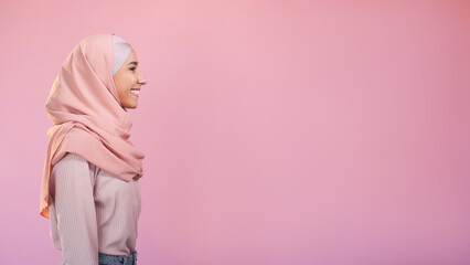Muslim beauty. Friendly expression. Optimistic attitude. Profile of cheerful woman in hijab...