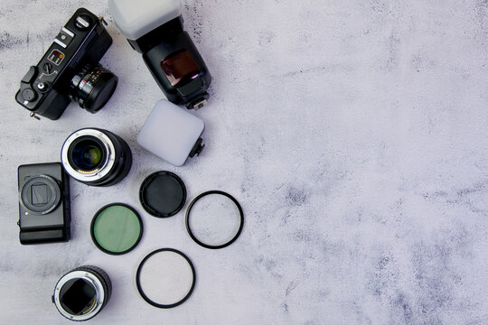 Photographer equipment on a white background Top view with copy space