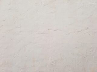 Rough white abstract background. Architecture and construction. Full frame of white cement wall. Wall texture with cracks