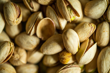 Pistachio nuts. Many pistachios in a pile.