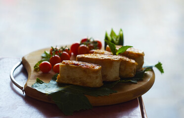 small tomatoes and lavash on the board