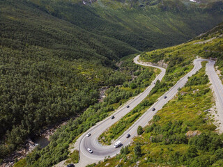 Fototapeta premium Borlaug, Norway. Cars Goes On Serpentine Mountain Road . Famous Norwegian Landmark And Popular Destination. Norwegian Hemsedalsvegen road In Summer Day.
