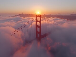 Golden Gate Bridge viewed from a drone at dawn, with fog surrounding the towers, showcasing a...