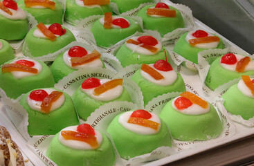 Typical Sicilian dessert of Southern Italy called CASSATINA SICILIAN and the italian text