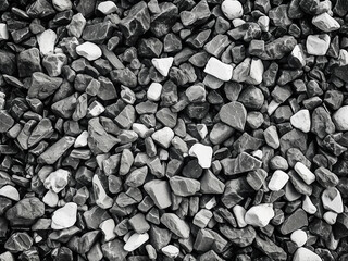 Detailed texture of crushed stone in black and white
