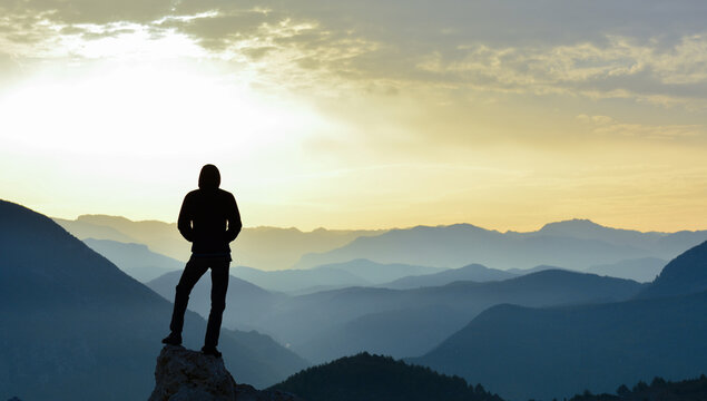 Young Man Watching Sunrise Silhouette