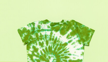 Green Tie-Dye T-Shirt on Light Green Background - Minimalist Fashion and DIY Clothing Trend