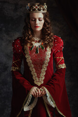 medieval queen in red dress with crown