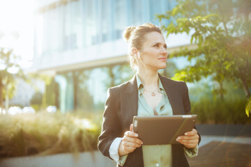 business woman near business center using digital tablet