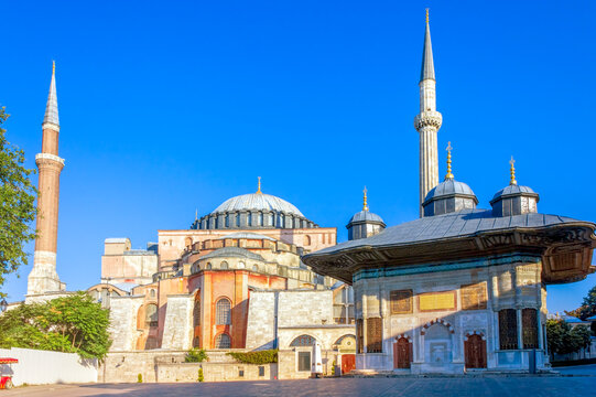 Istanbul, Turkey - August 09, 2021: Morning view of Istanbul featuring the Fountain of Ahmed III with the iconic Hagia Sophia in the background.
