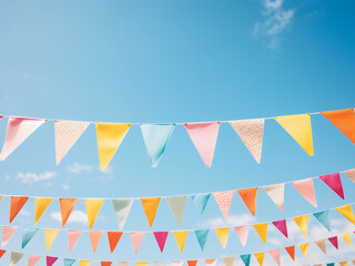 Obraz premium Festive holiday decorations feature colorful party flags against blue skies