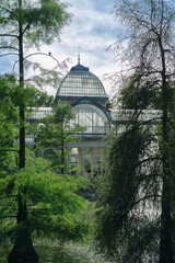 Photograph of the Crystal Palace in El Retiro park. Architecture. City of Madrid. Green area. European tour