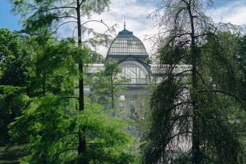 Photograph of the Crystal Palace in El Retiro park. Architecture. City of Madrid. Green area. European tour