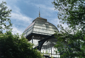 Photograph of the Crystal Palace in El Retiro park. Architecture. City of Madrid. Green area. European tour