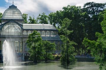 Photograph of the Crystal Palace in El Retiro park. Architecture. City of Madrid. Green area. European tour