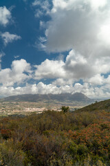 Beautiful landscape with mountains, cloudy blue sky. 